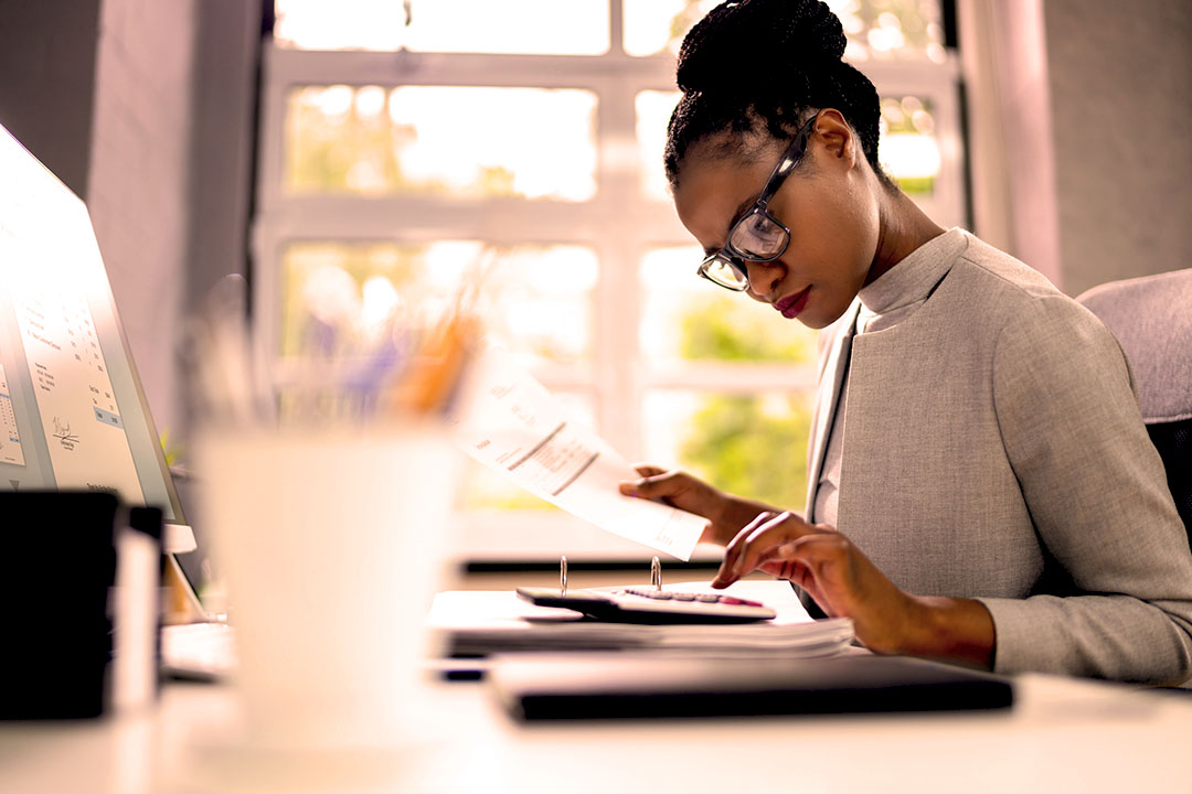 Image of a woman preparing tax documents